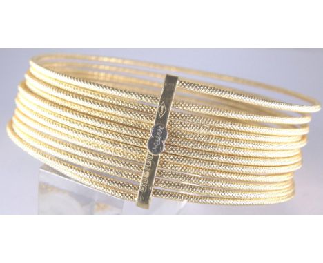18 ct gold spiral bangle, 46.4g