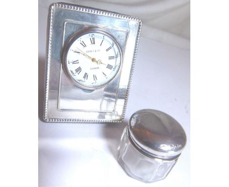 Hallmarked silver bedside clock, Assay London and a Hallmarked silver top dressing table jar , Assay Birmingham 1916