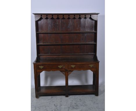 Old oak dresser, with a matched three shelf Delft rack, base with two drawers over a potboard, W140cm, H177cm.