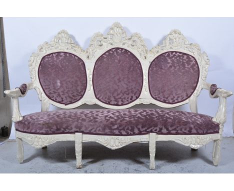 Painted 'American rococo' style sofa, carved decoration, upholstered back panels and seat, length 200cm