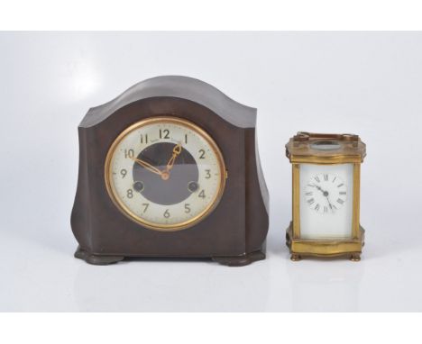 A Smiths Enfield brown bakelite mantel clock, circular dial with cream arabic numeral chapter ring, twin train movement strik