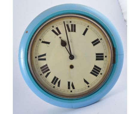 A blue painted wall clock, white enamel dial, spring driven movement, with pendulum.