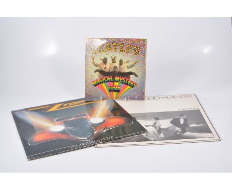 Marconiphone record player and a collection of LP records.