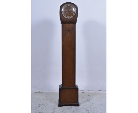 A Smiths oak cased Granddaughter longcase clock, three train movement with Westminster chime, height 132cm, complete with key