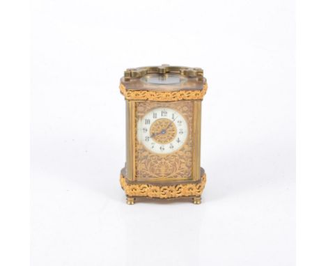 French brass-cased carriage clock, circular ivorine dial with a pierced panel, 13cm.