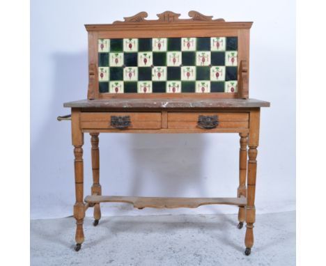 Victorian satin walnut washstand, raised tiled back, marbled top, two frieze drawers, turned and ringed legs, joined by a she