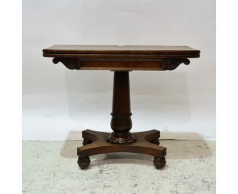 Early Victorian rosewood card table, rectangular foldover top with rounded corners, carved tablet frieze, leaf carved turned 