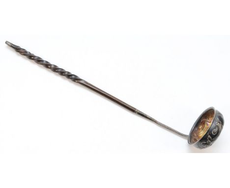 A Georgian silver toddy ladle, unmarked, with embossed swag decoration and Charles II coronation medal bottom, whale bone han