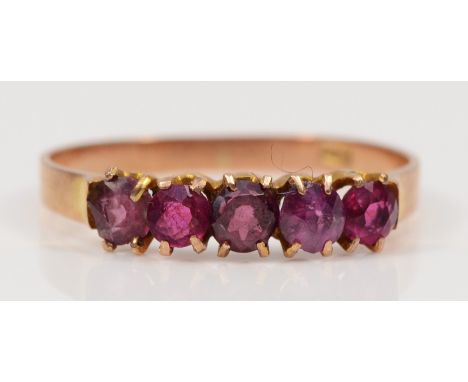 A 9ct rose gold five stone garnet dress ring, Q-R, 1.4gm. 