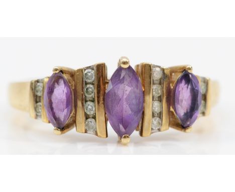 A 9ct gold three stone amethyst and eight cut diamond dress ring, R, 2.8gm. 