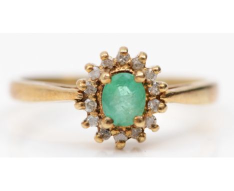 A gold emerald and eight cut diamond cluster ring, unmarked, stated weight .10, N-O, 2.1gm. 