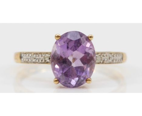 A 9ct gold amethyst and eight cut diamond dress ring, P, 2gm. 