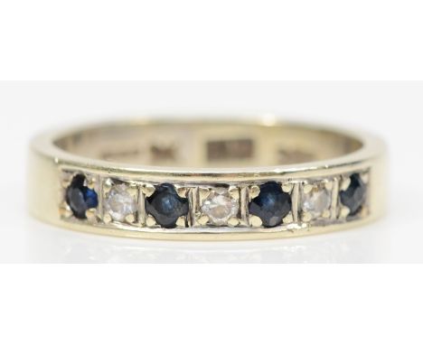 A 9ct white gold sapphire and brilliant cut diamond dress ring, L-M, 3.3gm. 