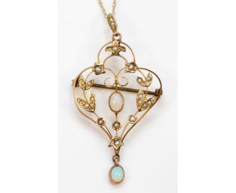 An Edwardian gold seed pearl and opal open work floral pendant, flashes of blue, green and red, 53 x 25, on a 9ct gold chain,