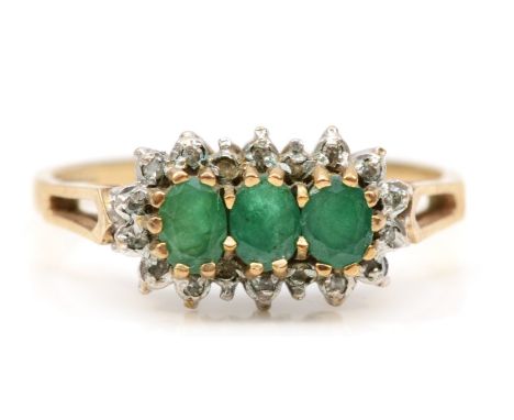 A 9ct gold three stone emerald and eight cut diamond dress ring, N, 2.1gm. 