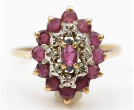 A 9ct gold ruby and eight cut diamond marquise dress ring, L, 2.1gm. 