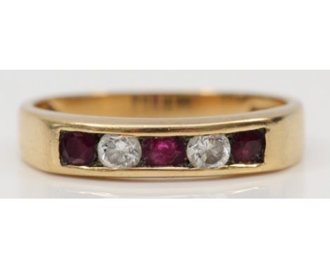 A 9ct gold ruby and brilliant cut diamond dress ring, O, 2.6gm. 