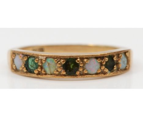 A 9ct gold opal and emerald dress ring, P, 2.5gm. 