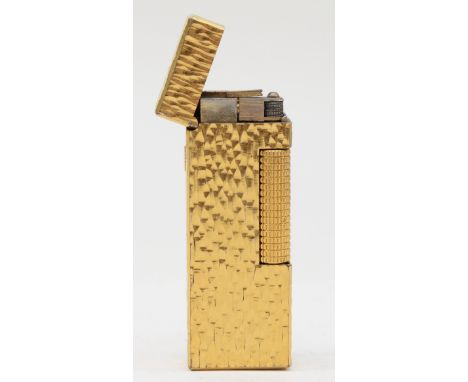 Dunhill, a gold plated rectangular gas lighter, US.RE24163, 6.5 x 2.5cm. 