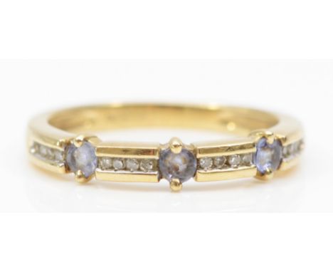 A 9ct gold tanzanite and channel set eight cut diamond dress ring, O, 2.2gm. 