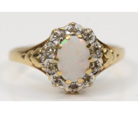 A 9ct gold opal and eight cut diamond dress ring, O, 1.9gm. 