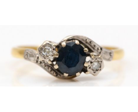 An 18ct gold three stone sapphire and eight cut diamond dress ring, R, 3.2gm. 