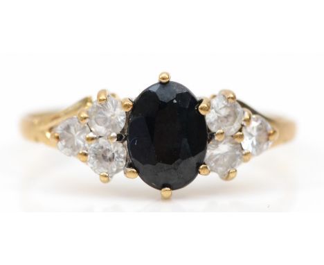 A 9ct gold sapphire and white stone dress ring, K, 1.3gm. 