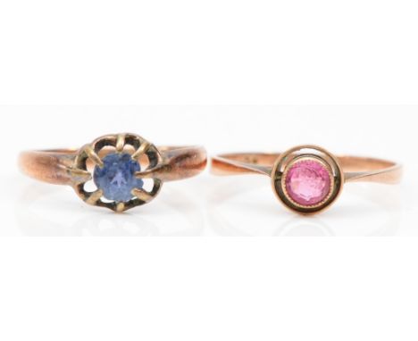 An Edwardian 9ct rose gold blue paste stone dress ring, L, together with another 9ct rose gold paste stone ring, N, 2.5gm. 