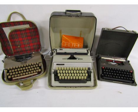 3 vintage typewriters - Oliver Courier, Gabriele 25 and the Baby Empire Deluxe and some typewriter ribbons