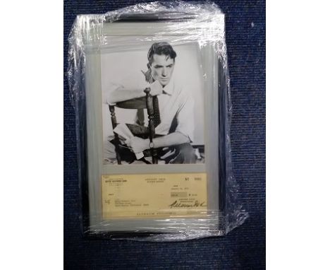 Gregory Peck signed cheque dated 10th Jan 1973 professionally framed and mounted with 10x 8 b/w portrait photo to an overall 