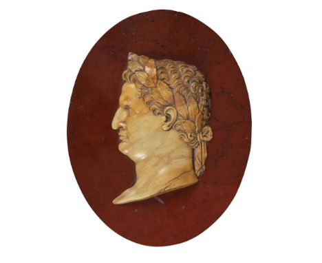 AN ITALIAN GIALLO ANTICO OVAL RELIEF PORTRAIT OF THE ROMAN EMPEROR VESPASIAN (9 AD-79 AD)LATE 19TH CENTURY Mounted on a Griot