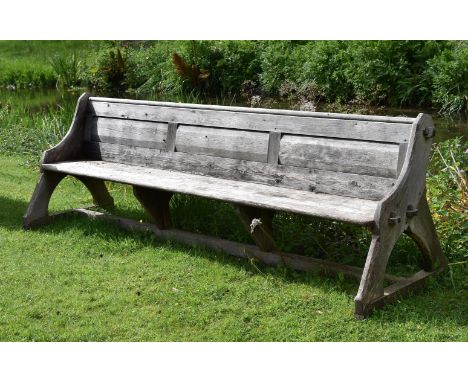 A LARGE REFORMED GOTHIC STYLE WOODEN BENCHCIRCA 187088cm high, 315cm wideCondition Report: There are marks, scratches, chips,