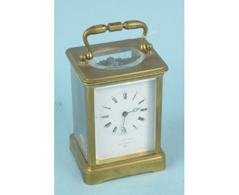 A Victorian brass cased carriage clock with key, the face marked Field &amp; Sons Aylesbury, engraved to the top 'Presented t