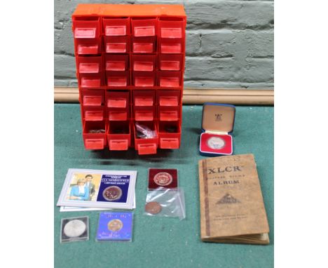 Various coinage housed in plastic multi drawer store plus loose collectors crowns and a small vintage stamp album