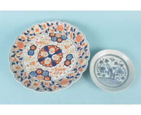 An Oriental Imari decorated plate, 29cm dia (slight paint loss on surface) plus a small saucer from the 'Tek Sing' wreck sold