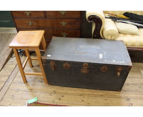 A metal clad travelling trunk and a beech high stool