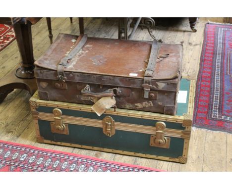 A leather suitcase and a travelling trunk