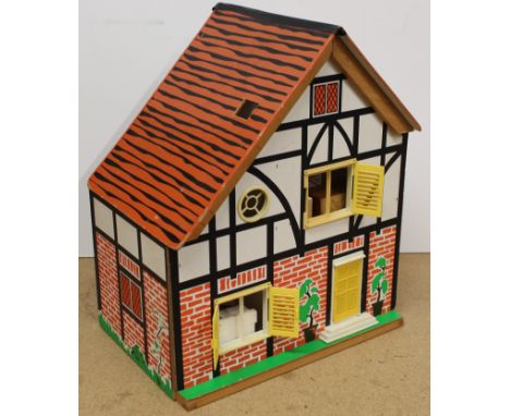 A vintage wooden and board constructed dolls house, 42cm tall plus a selection of dolls furniture