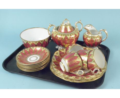 A 19th Century Staffordshire puce and gold part tea service 