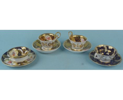 Four early 19th Century hand painted cabinet cups and saucers, one decorated with birds marked 2/4843 to base, a pair of heav