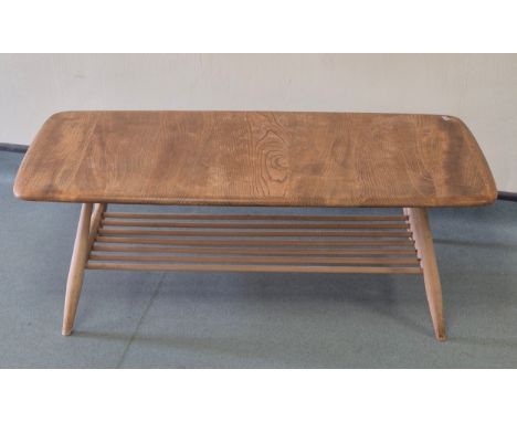 Blonde ercol elm wood coffee table. Top in need of attention. 36x103x44.5cm 