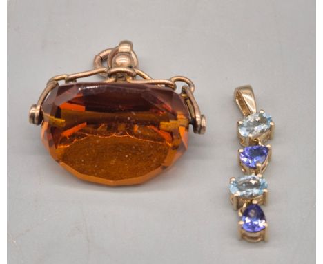 9ct yellow gold and four stone pendant. Together with a 9ct yellow gold and orange glass swivel fob. 