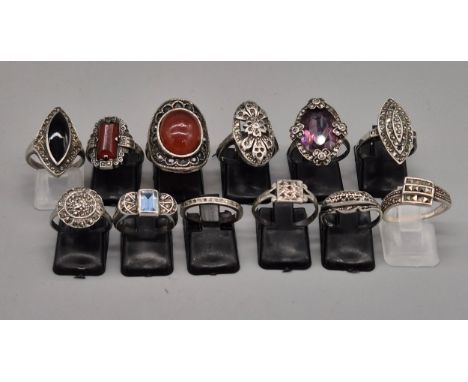 A Collection of twelve 925 silver rings; Mostly marcasite stone rings in an art deco manner. 