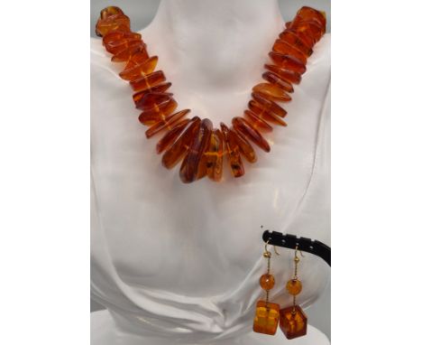 Vintage amber necklace together with a pair of amber and gold earrings. 82.41grams. 