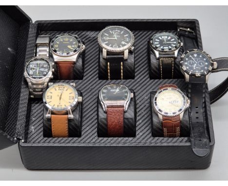 A watch case containing a collection of watches; Rotary, Sekonda, Fossil x2 and various others.