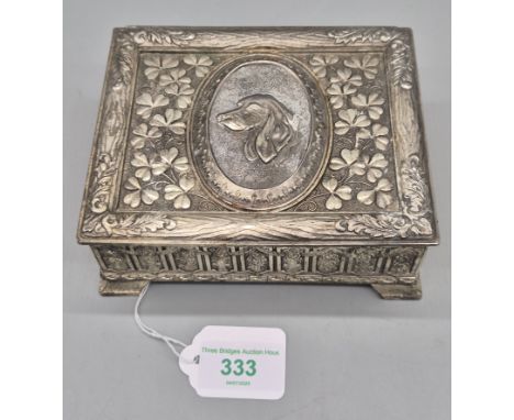 Heavy plated cigarette case. Detailed with a Relief dog plaque to the lid. 6x15x12cm. 