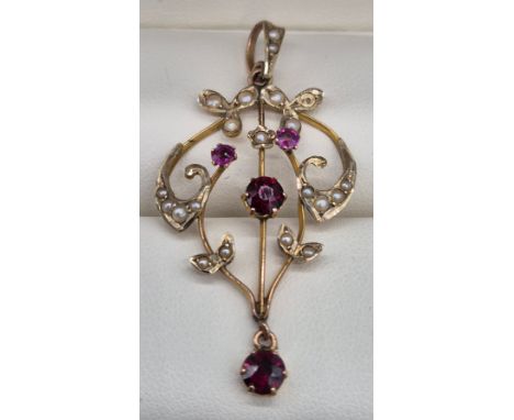 Edwardian 9ct yellow gold, garnet and seed pearl pendant. 2.61Grams.Missing a pearl