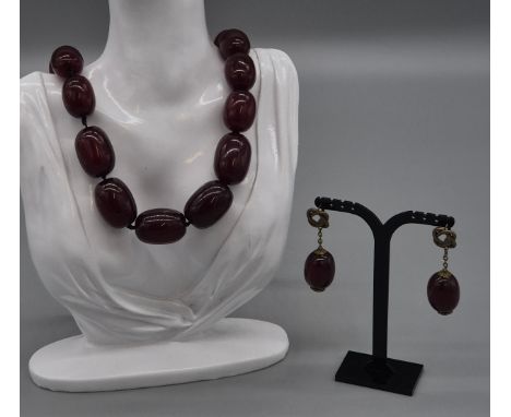 Graduating Cherry Amber type resin necklace with matching earrings. 