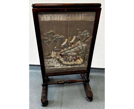 19th century rose wood screen, fitted with a needlework Chinese panel. 98x53cm.