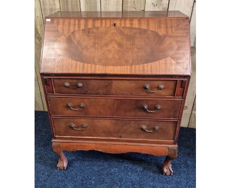 Mahogany writing bureau, raised on ball and claw feet. 98x76x43. Comes with key.